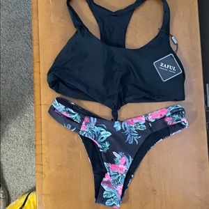 Two piece black and floral bathing suit